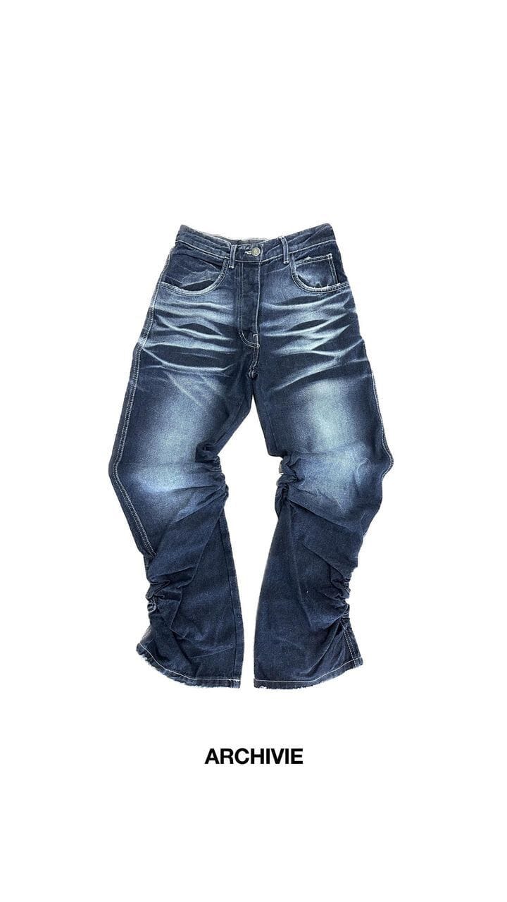 Pantalone di Jeans con arricciature laterali lavaggio blu